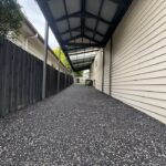 Gravel pathway under covered walkway
