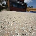 Polished concrete patio with house