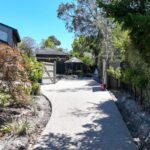 Concrete driveway with landscaping