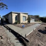 Concrete pathway poured at house